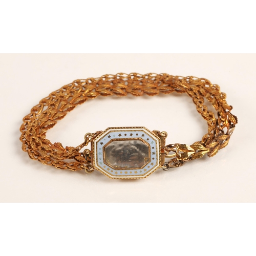 57 - Ladies three strand yellow metal bracelet with enamelled mourning clasp, 10.2g