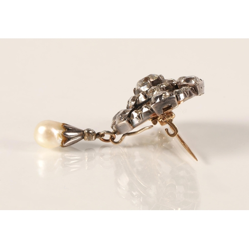 61 - Impressive diamond encrusted brooch, central 1.5 carat stone surrounded by six 0.20 stone interspers... 