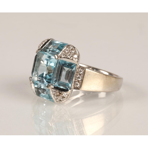 62 - Ladies 18ct white gold topaz ring, central stone surrounded by four rectangular stone interspersed w... 