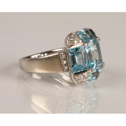 62 - Ladies 18ct white gold topaz ring, central stone surrounded by four rectangular stone interspersed w... 