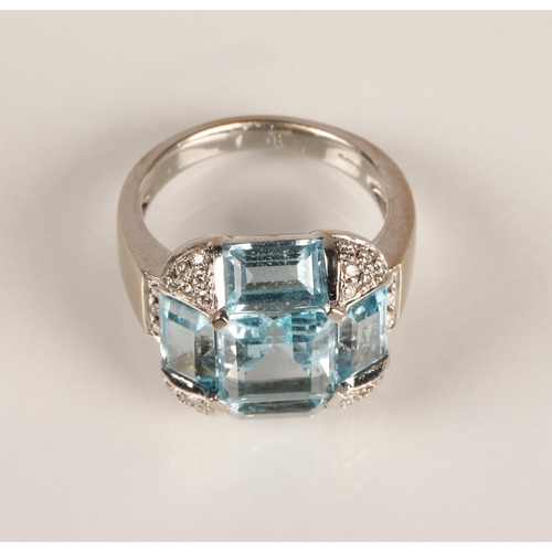 62 - Ladies 18ct white gold topaz ring, central stone surrounded by four rectangular stone interspersed w... 