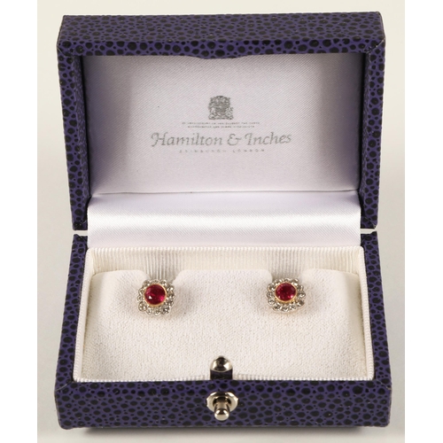 66 - Pair of ladies 18ct yellow gold diamond and ruby earrings, central ruby surrounded by twelve small d... 