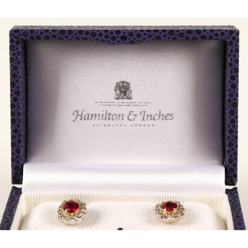 66 - Pair of ladies 18ct yellow gold diamond and ruby earrings, central ruby surrounded by twelve small d... 