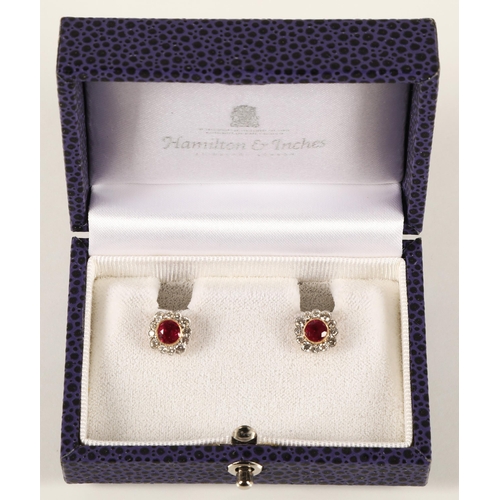 66 - Pair of ladies 18ct yellow gold diamond and ruby earrings, central ruby surrounded by twelve small d... 