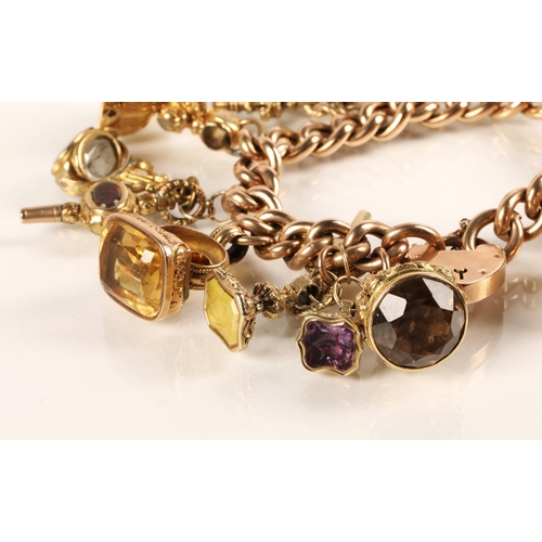 71 - Gold hollow curb link charm bracelet with seventeen assorted charms to include 9ct gold masonic ball... 