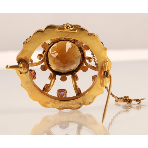 74 - Victorian gold circular brooch set with central cairngorm stone surrounded by six smaller gemstones,... 