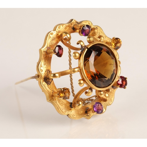 74 - Victorian gold circular brooch set with central cairngorm stone surrounded by six smaller gemstones,... 
