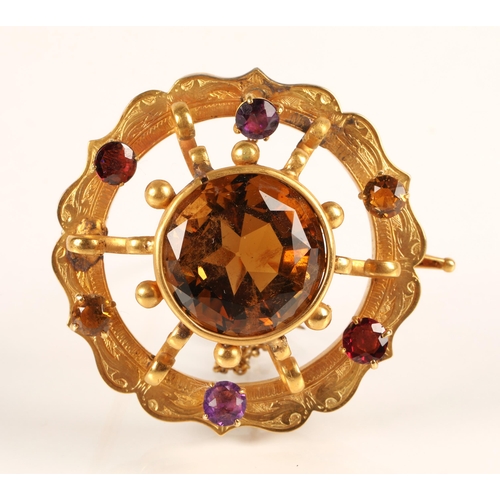 74 - Victorian gold circular brooch set with central cairngorm stone surrounded by six smaller gemstones,... 
