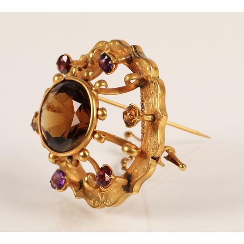 74 - Victorian gold circular brooch set with central cairngorm stone surrounded by six smaller gemstones,... 