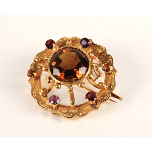 74 - Victorian gold circular brooch set with central cairngorm stone surrounded by six smaller gemstones,... 