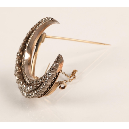 75 - Diamond crescent brooch set with three rows of graduated old cut diamonds set in silver and gold, gr... 