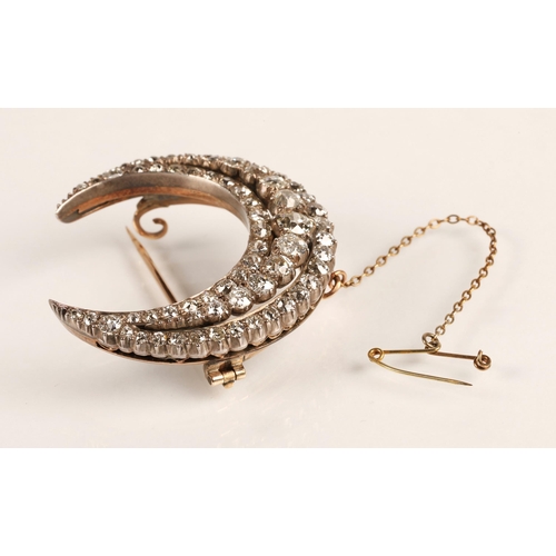75 - Diamond crescent brooch set with three rows of graduated old cut diamonds set in silver and gold, gr... 