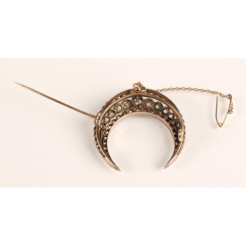 75 - Diamond crescent brooch set with three rows of graduated old cut diamonds set in silver and gold, gr... 
