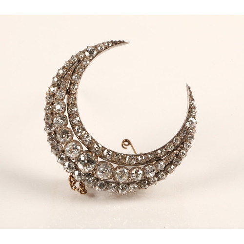 75 - Diamond crescent brooch set with three rows of graduated old cut diamonds set in silver and gold, gr... 