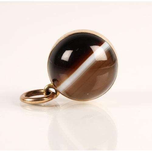 78 - Victorian agate spherical locket pendant with yellow metal mounts
