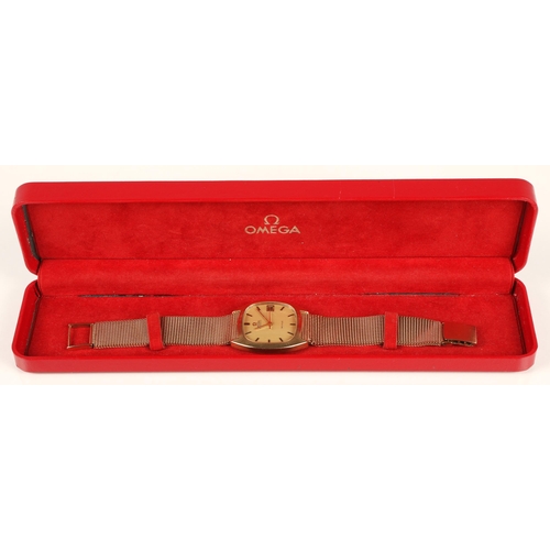 84 - 9ct gold Omega automatic wrist watch, champagne dial with baton hour markers and date aperture, on a... 