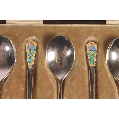 13 - Set of six Geo. V silver and enamel teaspoons, with thistle terminals leading to hammered bowls, Ber... 