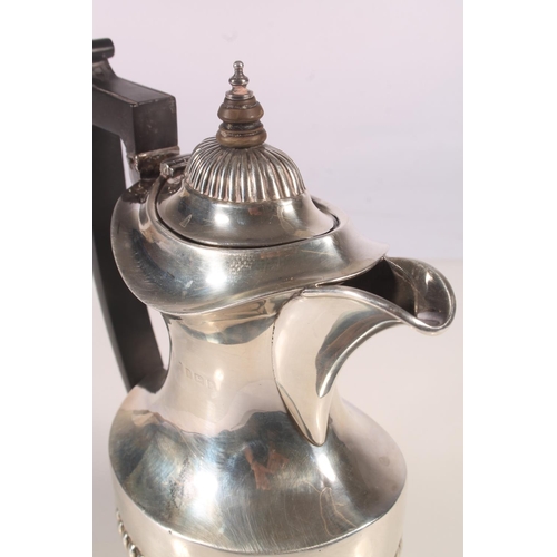 19 - Geo. V silver water pot, of baluster form with ebonised angular handle and half lobed body, Joseph G... 