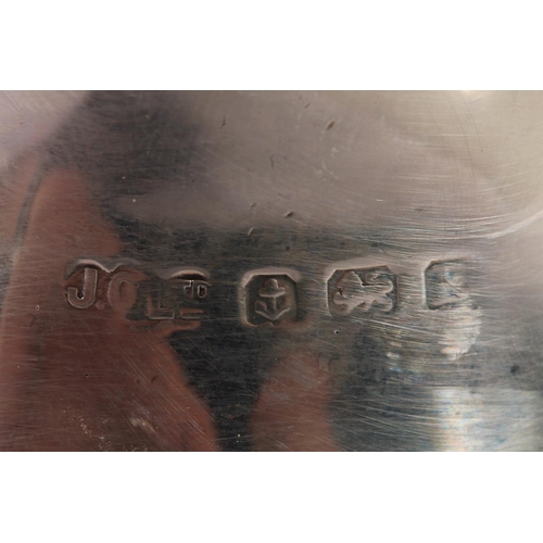 19 - Geo. V silver water pot, of baluster form with ebonised angular handle and half lobed body, Joseph G... 