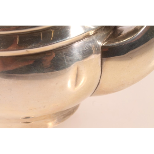 20 - Geo. V silver three piece tea set, the teapot with scrolled ebonised handle, gadrooned rim over a st... 