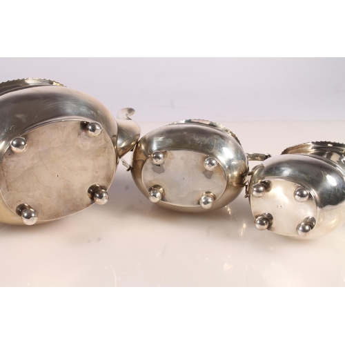 20 - Geo. V silver three piece tea set, the teapot with scrolled ebonised handle, gadrooned rim over a st... 