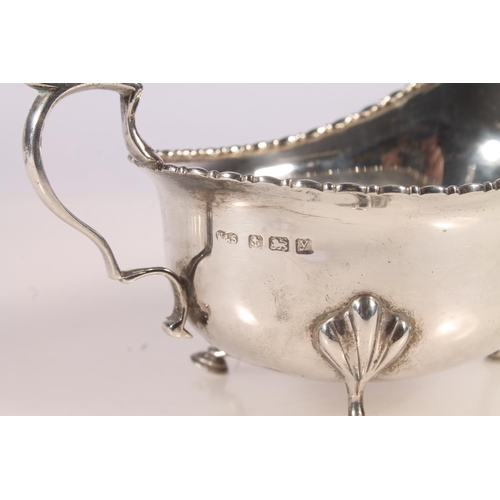 28 - Geo. V silver cream jug, of typical shape, Wilson and Sharp Birmingham 1923, together with one other... 