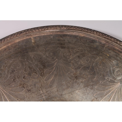 30 - Victorian silver tray of large proportions, the round tray with cast rope twist border around a spra... 