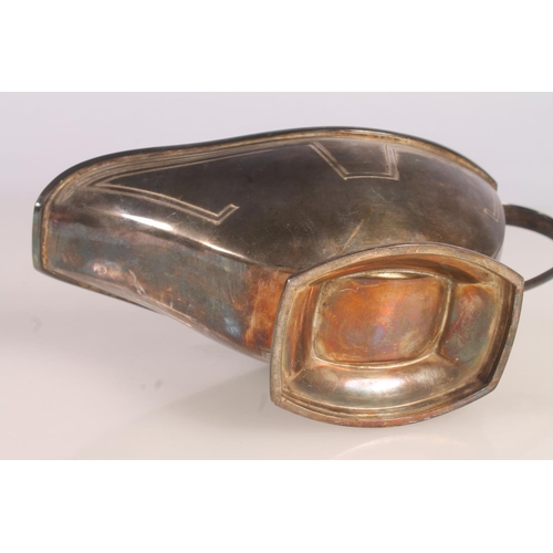33 - Geo. V Art Deco silver sauce boat, of typical symmetrical form with looped handle and stepped base, ... 
