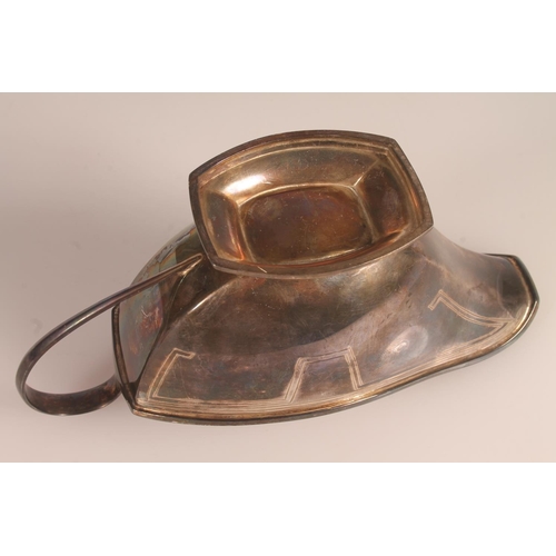 33 - Geo. V Art Deco silver sauce boat, of typical symmetrical form with looped handle and stepped base, ... 