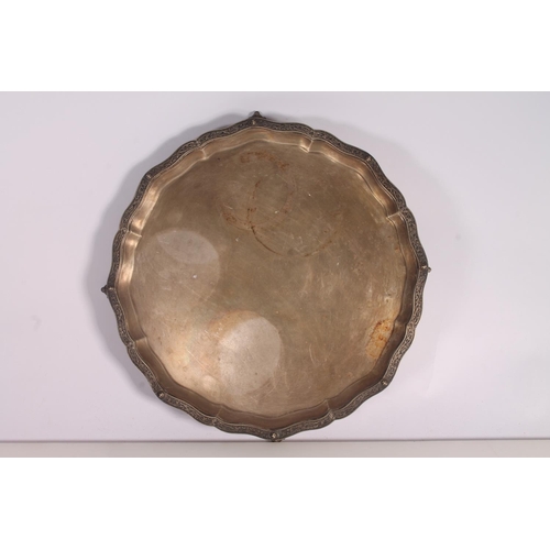 34 - Geo. VI silver salver, the pie crust border with moulded Nordic serpent knotwork, on four ball and c... 