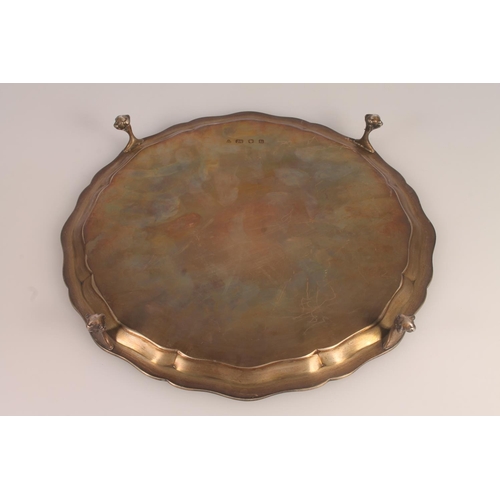 34 - Geo. VI silver salver, the pie crust border with moulded Nordic serpent knotwork, on four ball and c... 