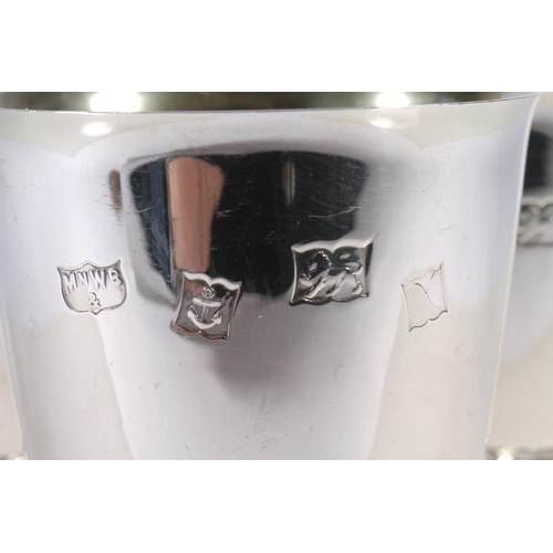 35 - Set of six ER.II Mappin and Webb silver goblets, the tapering round bowls with gilt interior, over a... 