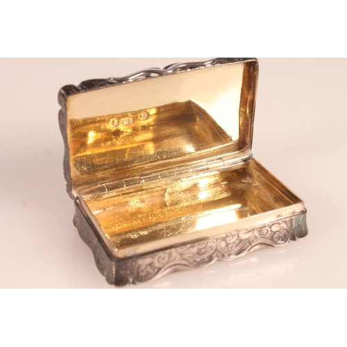4 - Victorian silver snuff box. with shaped edges and scrolling acanthus engraved body, opening to revea... 