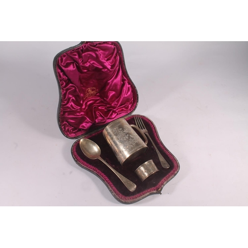 48 - Cased silver four piece christening set comprising fork, spoon, christening mug and napkin ring, Lon... 