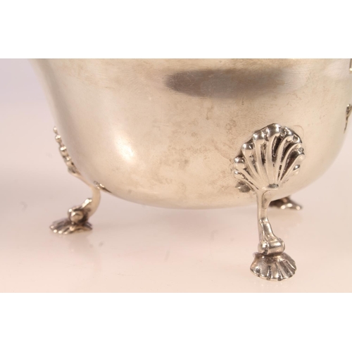 7 - Irish silver cream jug, the body of typical form with scalloped edge, acanthus scroll cast handle an... 