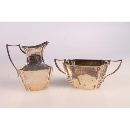 9 - Victorian silver three piece bachelors tea set, the teapot with ebonised angular handle and shaped t... 