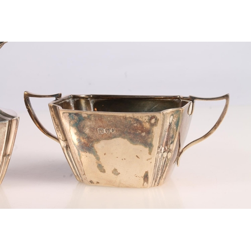 9 - Victorian silver three piece bachelors tea set, the teapot with ebonised angular handle and shaped t... 