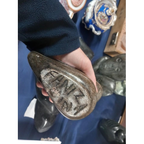 21 - Zimbabwean carved serpentine model of a bird signed to base FAINZNA, 18cm high.