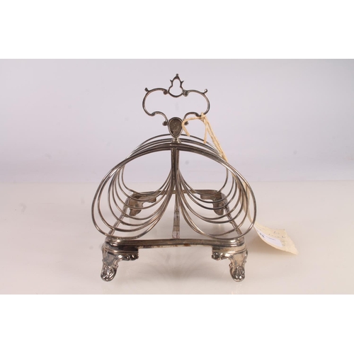 38 - Victorian silver six division toast rack raised on bracket feet with conch shell decoration, Robert ... 