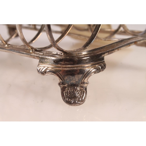 38 - Victorian silver six division toast rack raised on bracket feet with conch shell decoration, Robert ... 