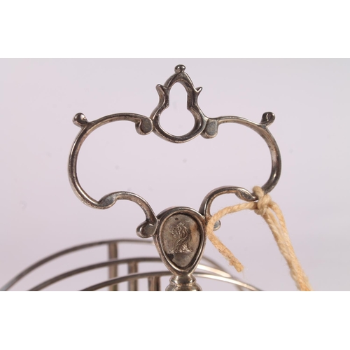 38 - Victorian silver six division toast rack raised on bracket feet with conch shell decoration, Robert ... 