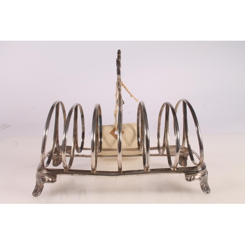 38 - Victorian silver six division toast rack raised on bracket feet with conch shell decoration, Robert ... 