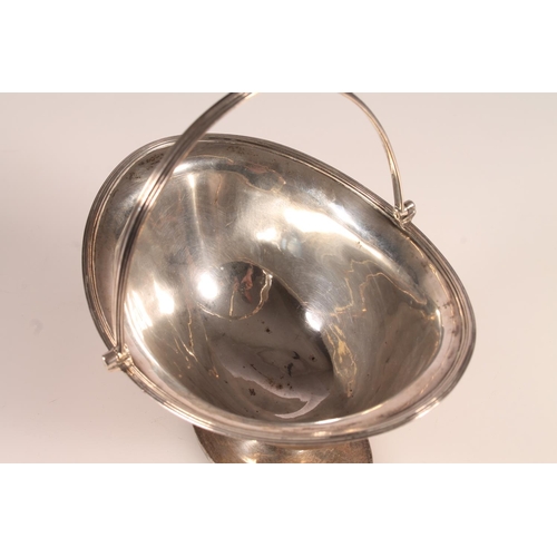 40 - Geo III sterling silver swing handled basket of plain oval form, raised on pedestal style base,&nbsp... 