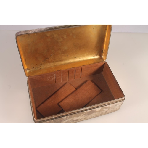 42 - Silver cigarette box of plain rectangular form with wood lined interior, inscribed 'Presented to Lt ... 