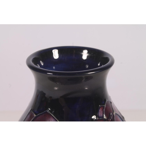 309 - Moorcroft Anenome pattern vase, of baluster form with typical tube-lined floral decoration on a blue... 
