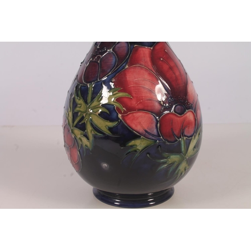 309 - Moorcroft Anenome pattern vase, of baluster form with typical tube-lined floral decoration on a blue... 