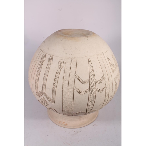 310 - Ladi Kwali (Nigerian 1925-1984); An Abuja biscuit ware studio pottery grain pot, of large proportion... 