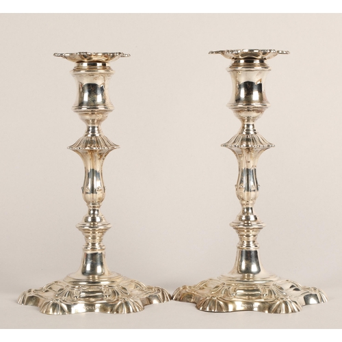 98 - Pair of weighted silver candlesticks, assay marked Chester 1906, maker Walker & Hall22.5cm high... 