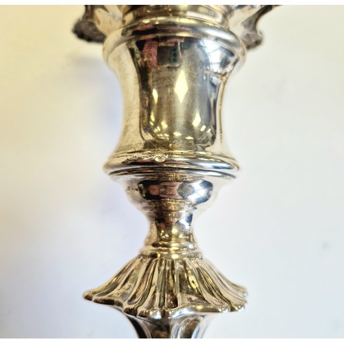 98 - Pair of weighted silver candlesticks, assay marked Chester 1906, maker Walker & Hall22.5cm high... 