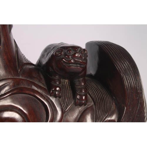 17 - Chinese carved hardwood Qilin or Foo Dog figure, 36cm high.